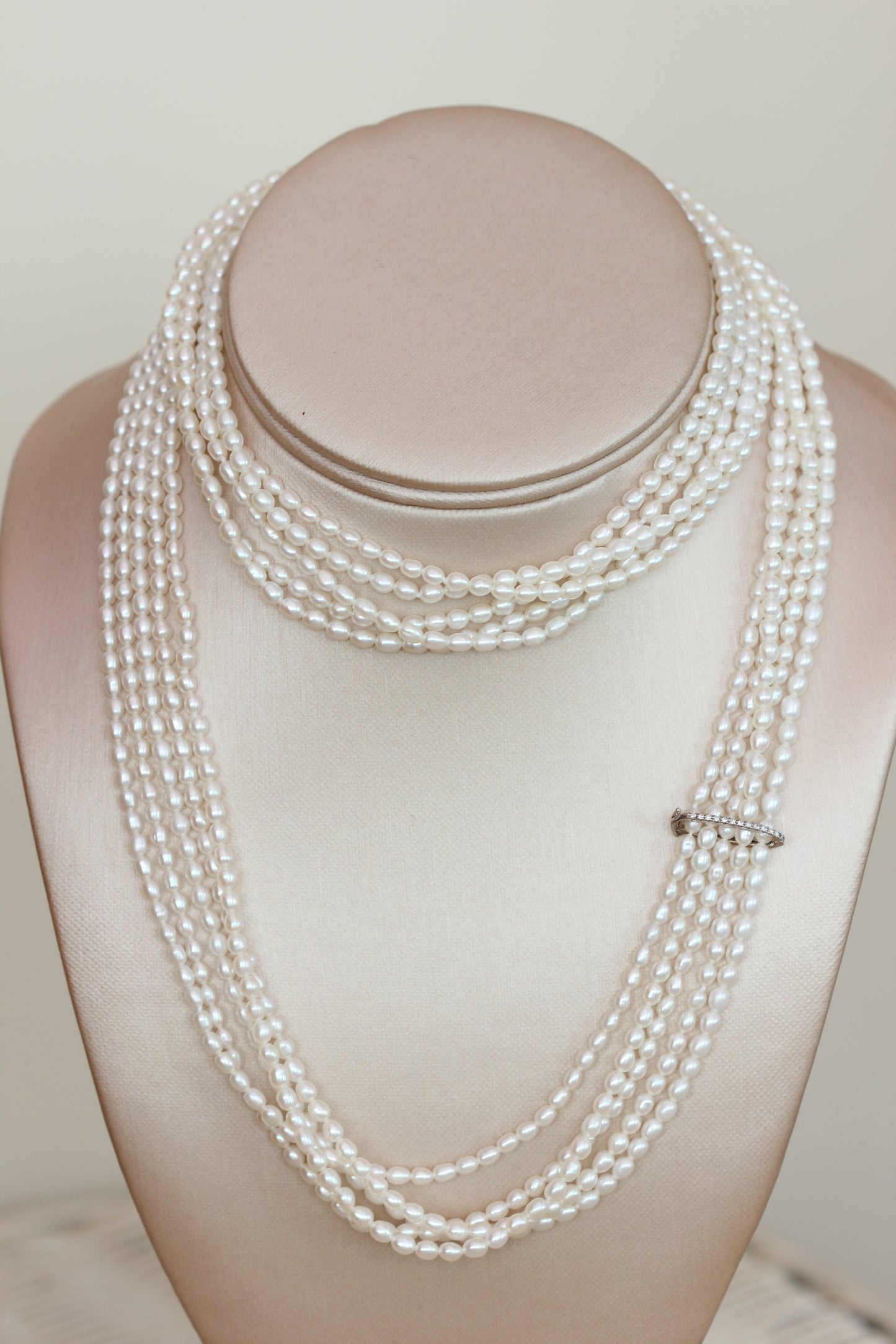 Diamond clasp pearl strands