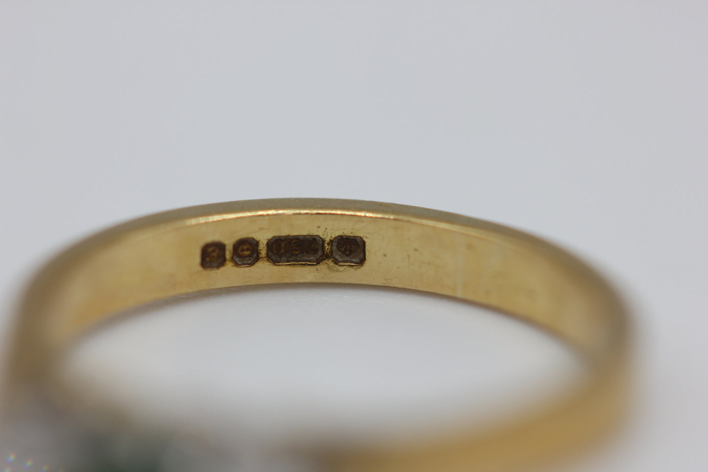 Emerald trilogy ring