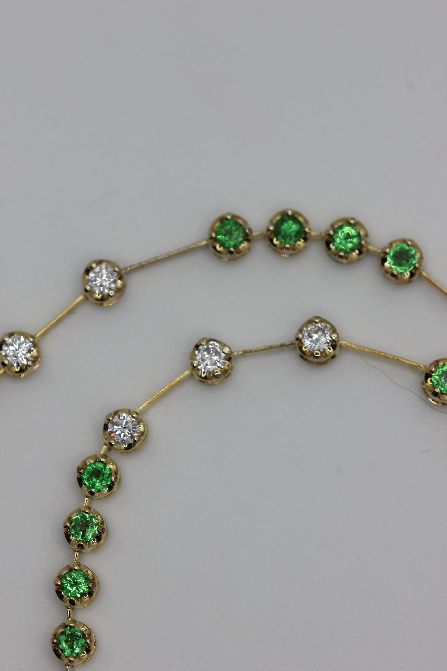 Emerald and diamond line necklace