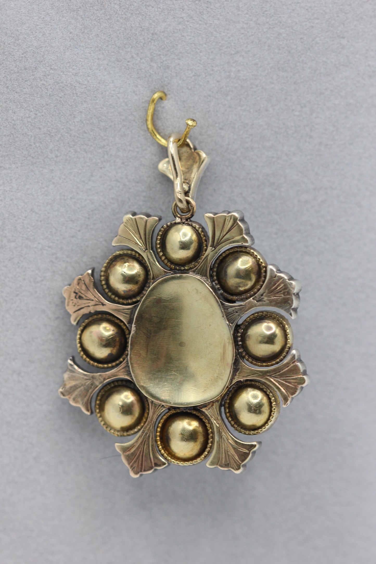 A natural saltwater pearl and emerald pendant