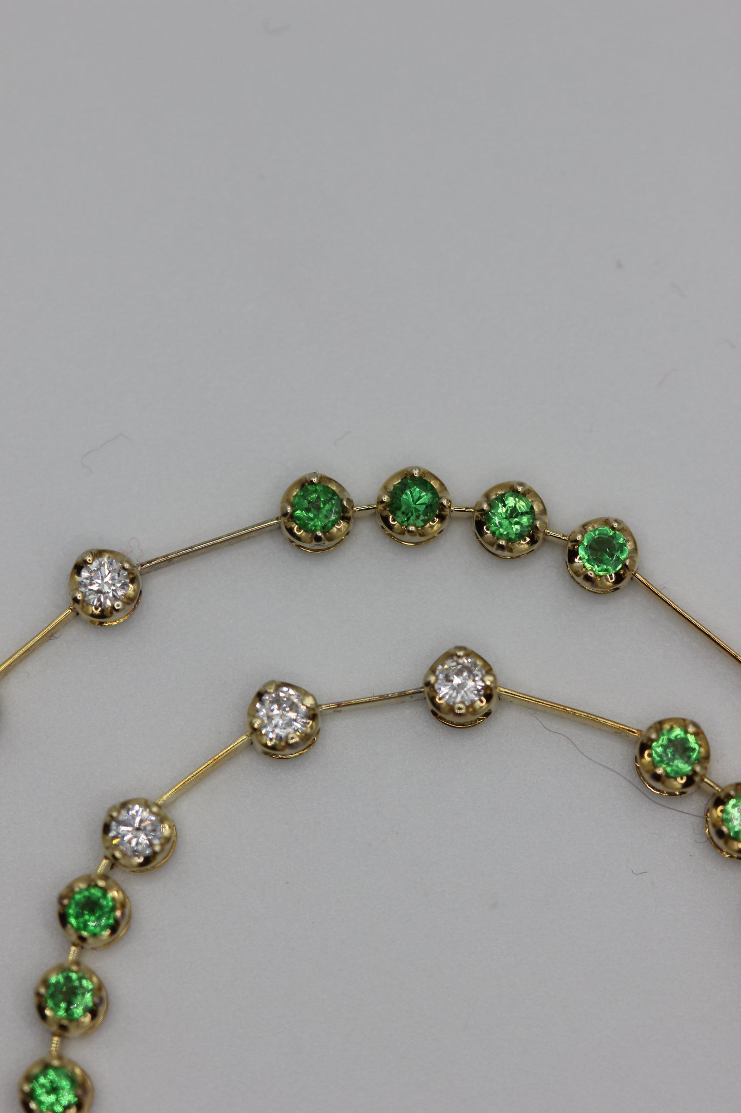 Emerald and diamond line necklace