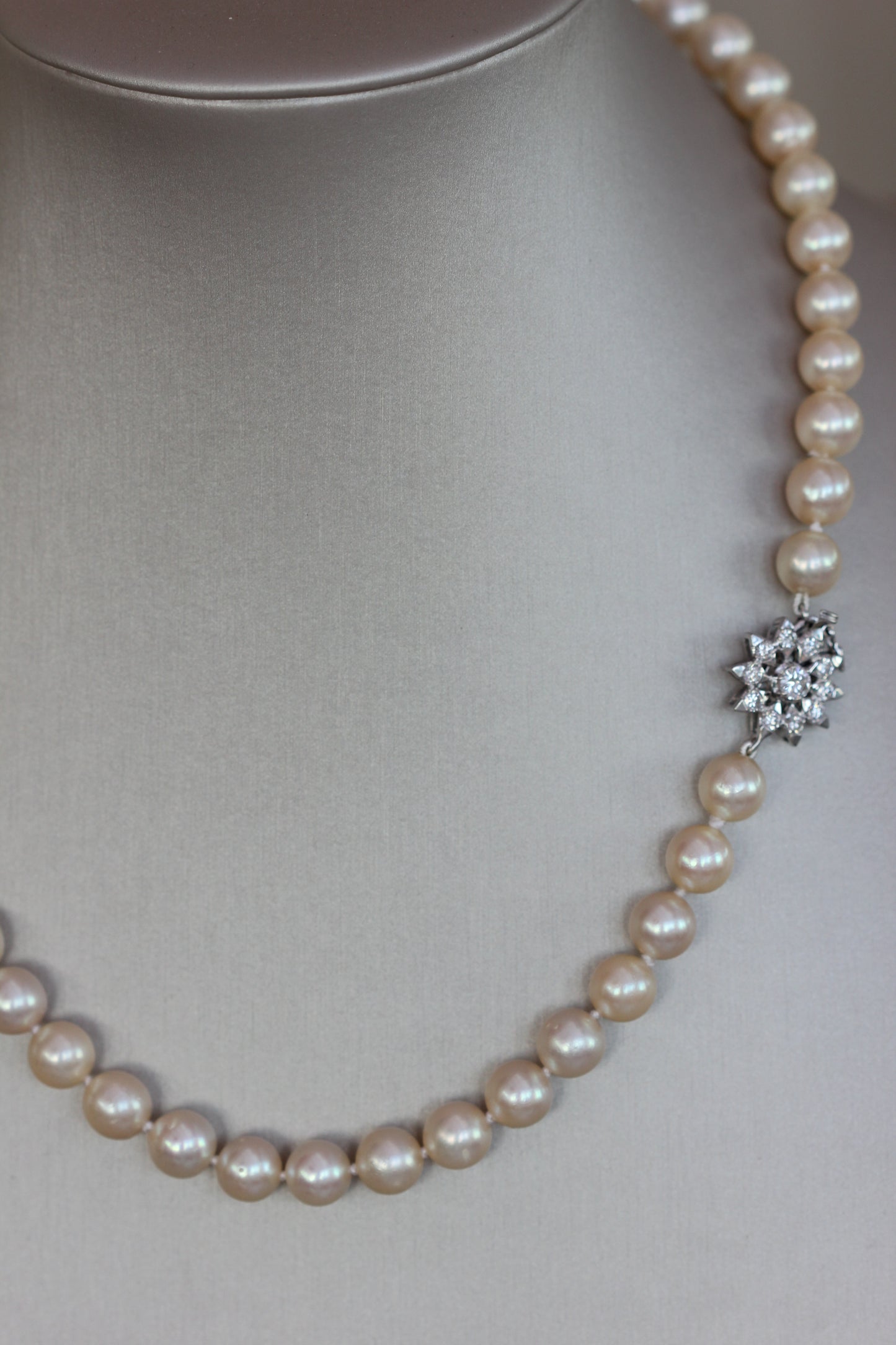 Pearl necklace with diamond flower clasp