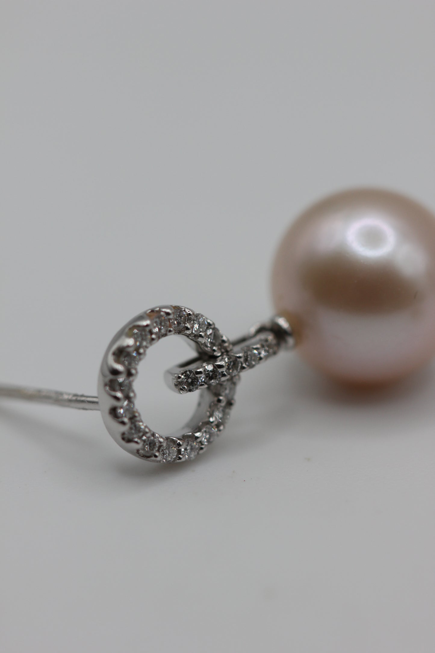 Pearl and diamond drop earring