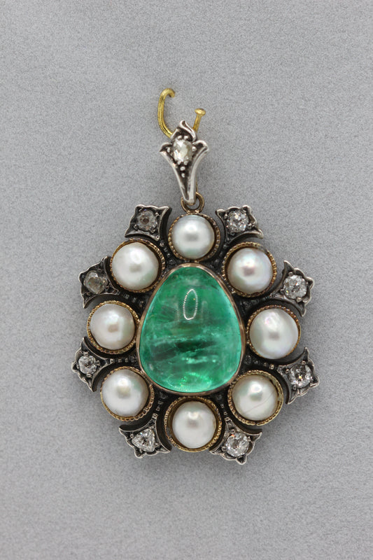 A natural saltwater pearl and emerald pendant