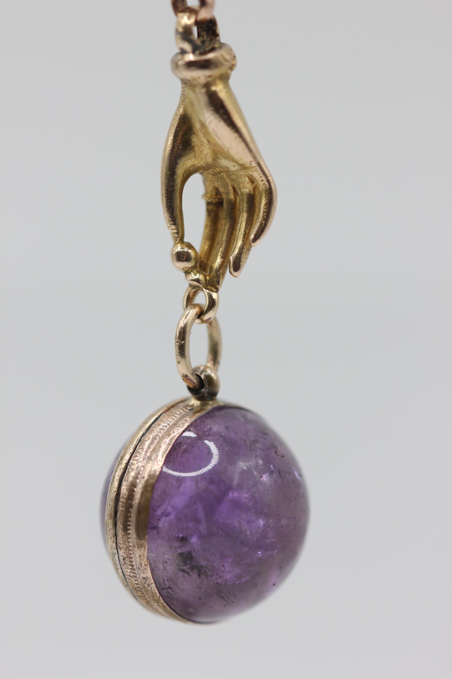 Gold hand pendant
