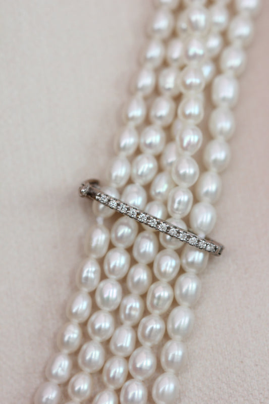 Diamond clasp pearl strands