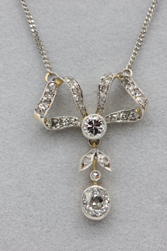 Diamond bow pendant