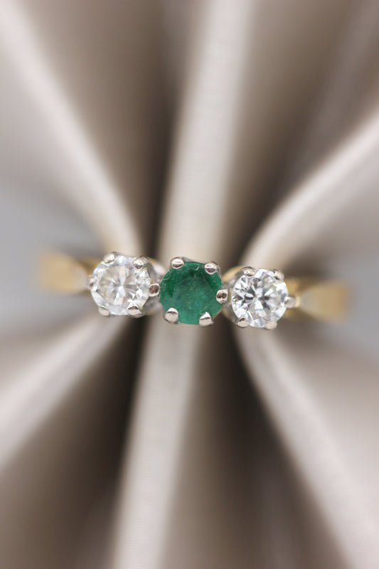 Emerald trilogy ring